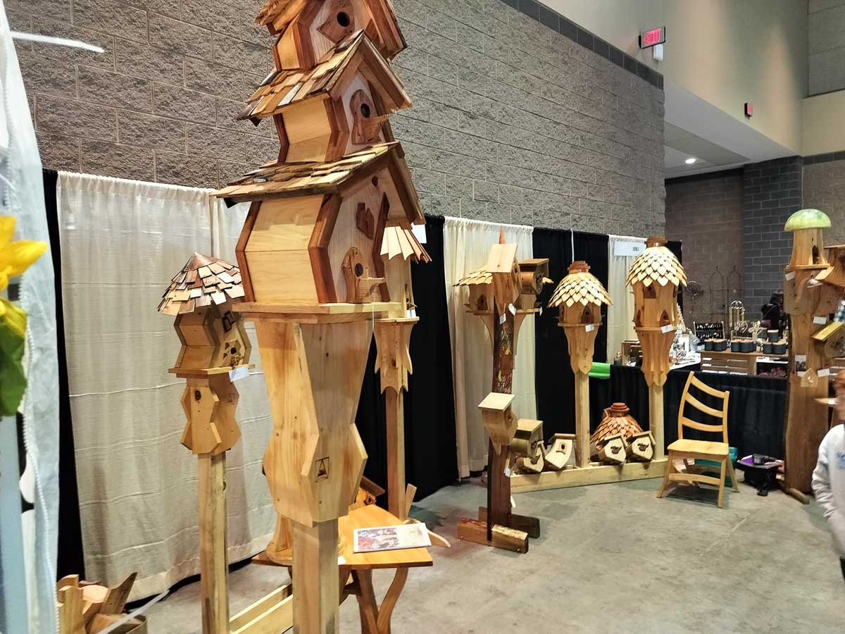 An indoor event featured Eric's handmade, wooden chairs, nesting boxes, and birdhouses.